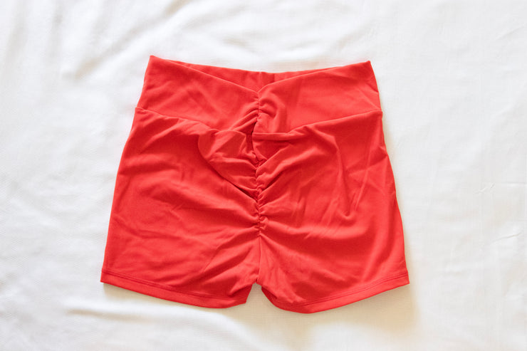 back of red scrunchy butt booty shorts
