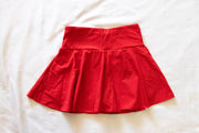 back of red womens tennis skirt