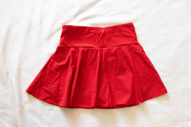 back of red womens tennis skirt