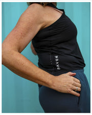 A person wearing a black tank top with the brand name 'RAVEN' visible on the front.