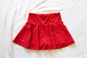 front of red womens tennis skirt