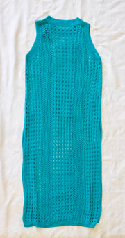 front of teal crochet dress / bathing suit cover on a white textured 